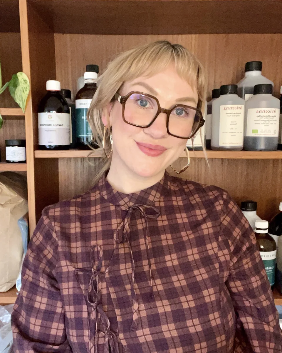 Portrait of Ellie Rose Grimsdale, Medical Herbalist, in her dispensary